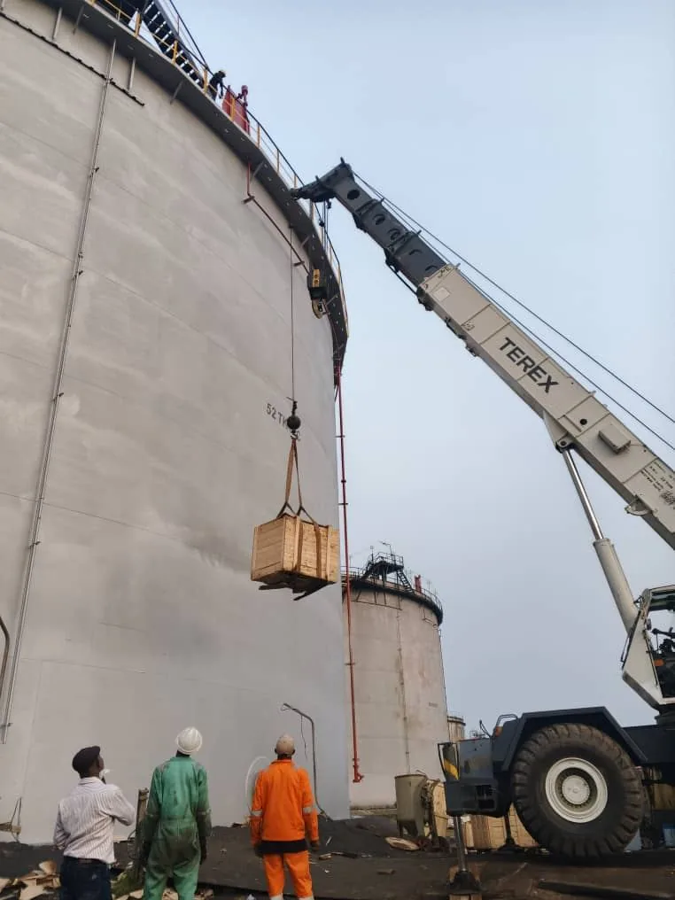 Crane lift during tank rehabilitation